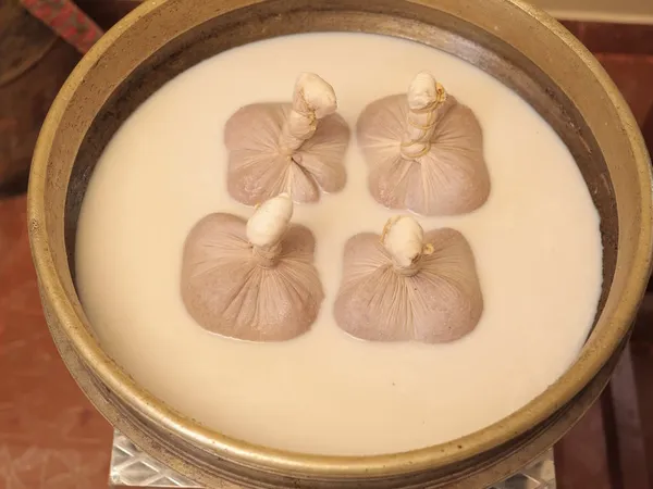 Njavarakizhi herbal rice bolus massage for muscle strengthening and nourishment